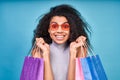 Emotional African American shopaholic girl photo studio