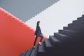 Attractive young european businesswoman walking on red and concrete staircase with mock up place. Success, finance and career