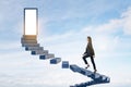 Attractive european woman climbing sky stairs to success and opprtunity with open door and mock up place Royalty Free Stock Photo