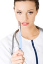 Attractive young female doctor with scalpel. Royalty Free Stock Photo