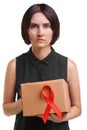 Beautiful woman holding the red ribbon, symbol of AIDS awareness isolated on a white background. World AIDS day concept.