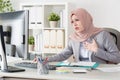 Attractive young female muslim office worker