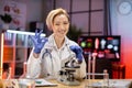 Attractive young female scientist supervisor using microscope research in laboratory. Royalty Free Stock Photo