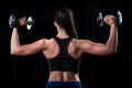 Attractive young fit sportswoman working out in gym lifting Royalty Free Stock Photo