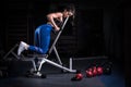 Attractive young fit sportswoman working out in gym lifting Royalty Free Stock Photo