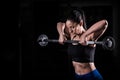 Attractive young fit sportswoman working out in gym lifting Royalty Free Stock Photo