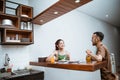 attractive young girl chatting with young man at bar table Royalty Free Stock Photo