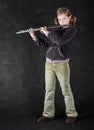 Attractive young girl flautist. Royalty Free Stock Photo