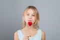 Attractive young girl holding red heart portrait Royalty Free Stock Photo
