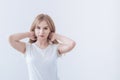 Attractive young girl holds hair with her hands Royalty Free Stock Photo