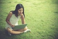 Attractive young girl with laptop outdoors. Beautiful woman work Royalty Free Stock Photo