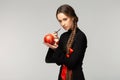 Attractive young girl with long braid and red bow Royalty Free Stock Photo