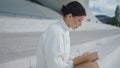 Girl student making notes in notebook sitting stairs closeup. Lady writing diary Royalty Free Stock Photo