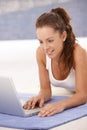 Attractive young girl using laptop at home Royalty Free Stock Photo