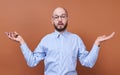 Surprised young guy in a shirt and phone in his hand Royalty Free Stock Photo