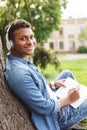 Attractive young guy is making some notes Royalty Free Stock Photo