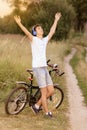 Attractive young guy with road bicycle outdoors Royalty Free Stock Photo