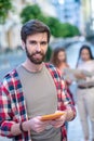 Attractive young guy with a tablet in his hands Royalty Free Stock Photo