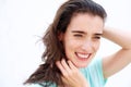 Attractive young lady smiling with hands in hair Royalty Free Stock Photo