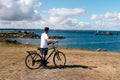 Attractive young male riding bicycle in the Island of Batz Royalty Free Stock Photo