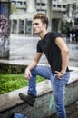 Attractive young man with backpack standing outdoor Royalty Free Stock Photo