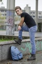 Attractive young man with backpack standing Royalty Free Stock Photo