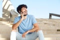 Attractive young man with beard talking on mobile phone Royalty Free Stock Photo