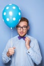 Attractive young man with a blue balloon in his hand. Party, birthday, Valentine Royalty Free Stock Photo