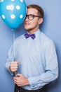 Attractive young man with a blue balloon in his hand. Party, birthday, Valentine Royalty Free Stock Photo