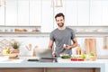 Attractive young man cooking with mixing bowl Royalty Free Stock Photo