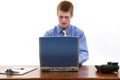 Attractive Young Man at Desk with Laptop Royalty Free Stock Photo