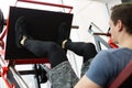 Attractive Young Man Doing Leg Press On Machine In Gym. Royalty Free Stock Photo
