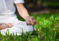 Attractive young man doing yoga. Focus on hand of maditation. Royalty Free Stock Photo