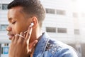 Attractive young man with eyes closed listening to music Royalty Free Stock Photo