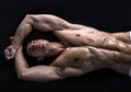 Attractive young man on the floor with muscular ripped body Royalty Free Stock Photo