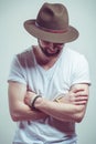 Attractive young man with hat smiling