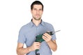 Attractive young man holding an electric drill Royalty Free Stock Photo
