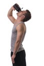 Attractive young man holding protein shake bottle