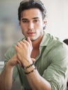 Attractive young man indoors wearing a shirt