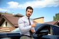 Attractive young man near luxury car Royalty Free Stock Photo