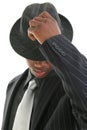 Attractive Young Man In Pinstripe Suit Tipping His Hat Royalty Free Stock Photo