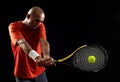 Attractive young man playing tennis portrait