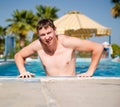 Attractive Young man in the pool Royalty Free Stock Photo