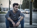 Attractive young man at night with city lights Royalty Free Stock Photo