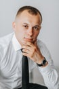 an attractive young man poses as a groom before a wedding Royalty Free Stock Photo