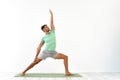 Attractive Young Man practicing advanced yoga on white background. A series of yoga poses. for good health. Sport Royalty Free Stock Photo