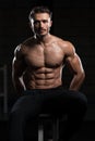 Attractive Young Man Resting In Gym Afther Exercise Royalty Free Stock Photo