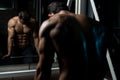 Attractive Young Man Resting In Gym Afther Exercise Royalty Free Stock Photo