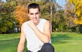 Attractive young man resting in park