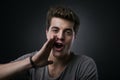 Attractive young man shouting out loud Royalty Free Stock Photo